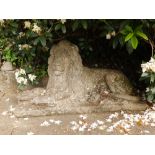 A large weathered garden statue of a recumbent lion, Height 28", Width 50". Separate viewing