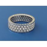 A 'Corsage' diamond honeycomb set 18ct white gold eternity ring, the three rows of diamonds of total