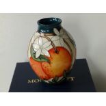 A modern boxed Moorcroft Oranges & Blossom pattern vase, 2009, 5.5" high.