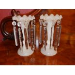A pair of Victorian milk glass lustres, 10.25" high. Separate viewing arrangements by appointment.