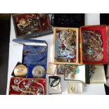 A case containing a large quantity of costume jewellery