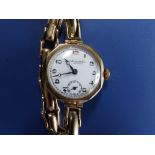 A lady's 9ct gold patent expanding bracelet wrist watch, the white enamel dial inscribed 'Thos.