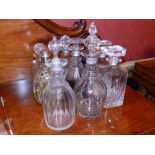 Nine various cut & other glass decanters.