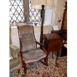 An upholstered mahogany rocking chair, a drop leaf mahogany night cupboard and a standard lamp. (
