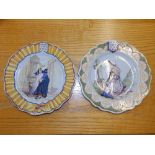 A pair of 19thC tin glazed plates depicting Breton women, 9.2" diameter - one a/f, together with