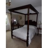 A mahogany open frame four poster bed having octagonal tapering & fluted foot posts, Height 85",