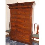 A Victorian mahogany tallboy, the cylinder moulded projecting cornice over two short & four long
