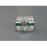 A 1950's diamond & emerald set platinum cocktail ring, the principal hexagonal diamond to centre