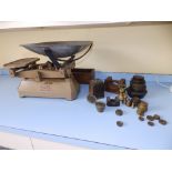 A set of Brecknell 15kg balance scales and a selection of weights. Separate viewing arrangements