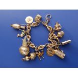 A modern charm bracelet set with 15 charms believed to have been purchased in Saudi Aarabia -