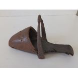 A Victorian leather covered side saddle stirrup.