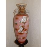 A late 19thC Japanese Satsuma ware vase decorated with white flower blossom on branches against a