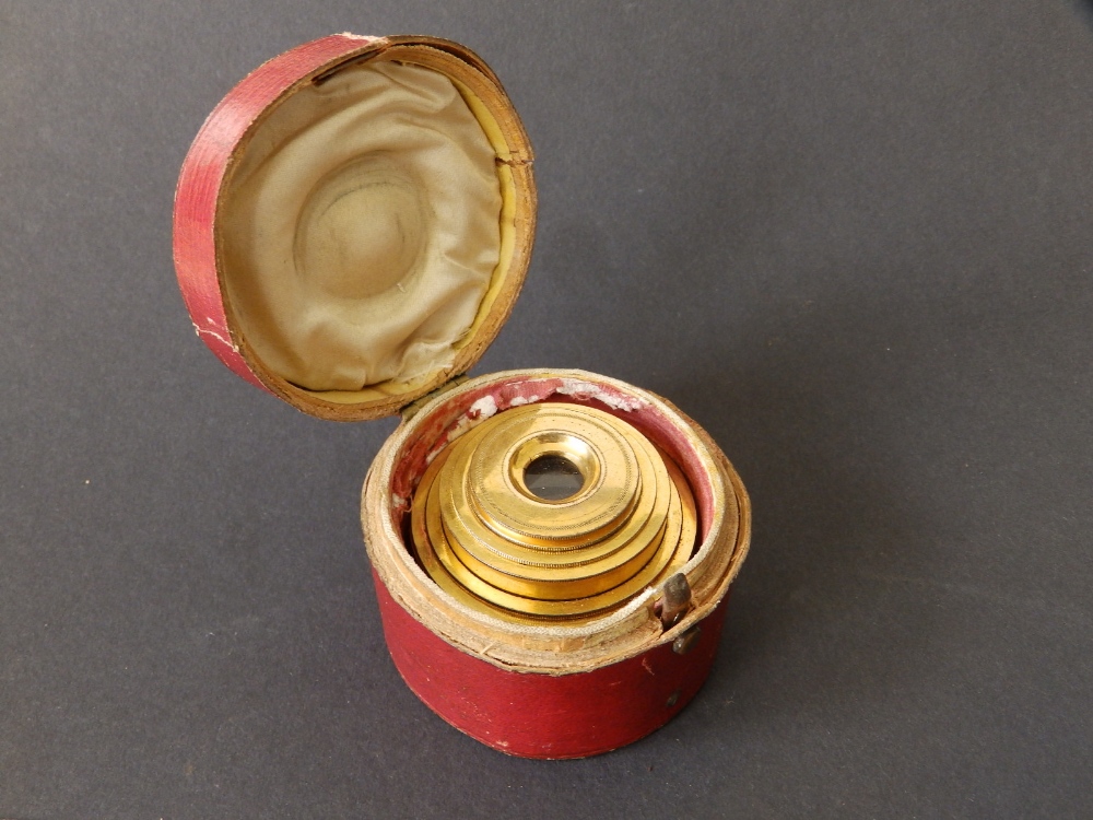 A 19thC cased six-drawer gilt brass & ivory monocular with gold pique decoration, 3.75" extended.