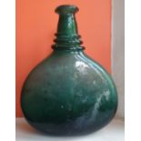An 18thC Persian green glass saddle flask, 9.75" high - cracked.