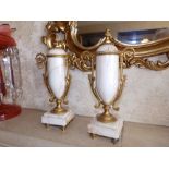 A pair of ormolu mounted white marble 'urns' of solid form with fixed covers, 10.75" high. (2)