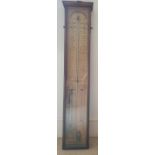 An Admiral Fitzroy barometer in glazed wooden case. 37.5" high.