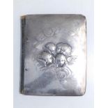 A silver-fronted address book decorated with cherubs' heads - WC, London 1904, 5.25" high.