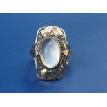 An art nouveau moonstone ring set in yellow metal. Finger size Q.