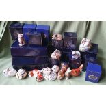 A collection of boxed Royal Crown Derby paperweights with gold coloured stoppers - some faded.