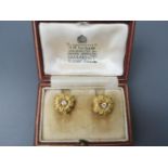 A pair of diamond set 18ct gold flowerhead earrings in a Garrard & Co. box, each clip-on earring