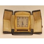 A cased Zenith 8 day travelling alarm clock - 'Metal Dore' - 8711, 3" high.