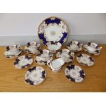 25 pieces of Coalport royal blue ground 'bat wing' tea china, comprising a bread & butter plate (