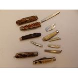 12 folding pen knives.