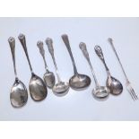 A Jensen Sterling silver spoon, seven other silver spoons and a pickle fork. (9)