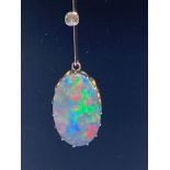 An Edwardian Lightning Ridge Australian black opal & diamond lavalier necklace pendant, the oval