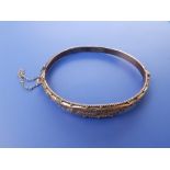 A 9ct gold bangle - repaired.