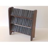 A set of 40 miniature Works of Shakespeare, Allied Newspapers Ltd, in wooden shelves.