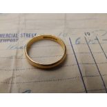 A 22ct gold wedding band - H. Samuel, Birmingham marks. Finger size N.