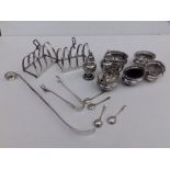 A pair of small silver toast racks - Alpha Brothers, Birmingham, a seven piece silver condiment