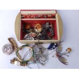 A red/cream jewellery box and contents, rings and other costume jewellery.