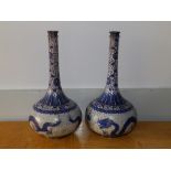 A pair of 19thC Oriental cloisonne blue ground dragon bottle vases, 11" high - a/f (2)