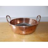 A Victorian two-handled copper pan, 12.5" diameter.