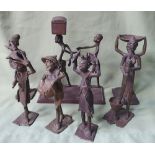 A collection of brass & bronze African figures, one depicting a figure enslaved.