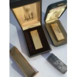 A Dunhill Tallboy lighter and three other Dunhill lighters. (4)