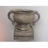 A Chinese Archaic style two-handled bronze vessel, the rounded body with fluting between friezes