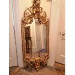 A Victorian gilt gesso girandole, 60" high.