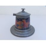A Moorcroft Tudric pewter mounted inkwell in pomegranate pattern - 01363, 4" overall diameter.