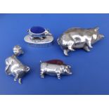 Three plated pin cushion pigs, the largest, 2.75" across and a pig vesta. (4)