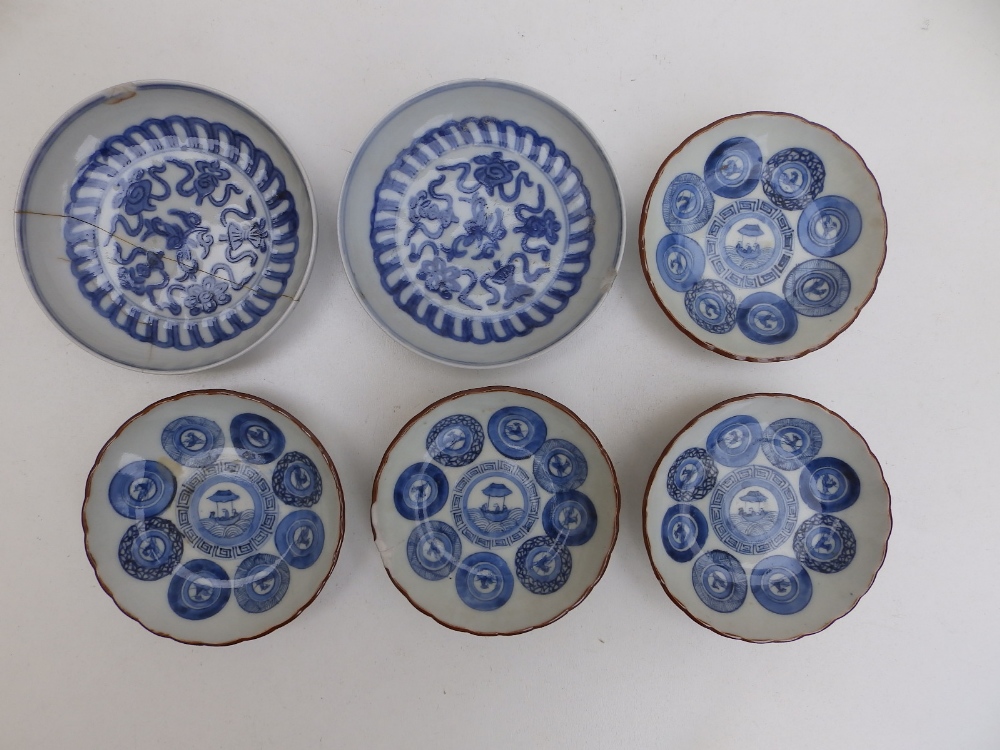 A set of four small Oriental blue & white porcelain dishes decorated roundels, 3.8" diameter - one