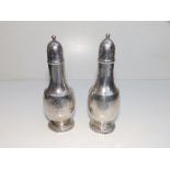 A pair of Tiffany Sterling silver pepperettes, 5.25" high. (2)