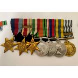 A WWII Royal Navy medal group awarded to Cdr. C. E. Smith RN, comprising Stars for 1939-45, Africa &