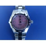 A boxed lady's stainless steel Tag Heuer Aquaracer bracelet wrist watch with pink pearl dial,