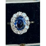 A certified natural 2.68 carat Sri-Lankan sapphire & diamond oval cluster ring, on 18ct gold