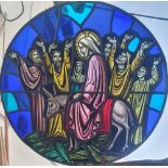 A large circular stained & painted glass panel depicting a religious scene, 18.5" diameter.