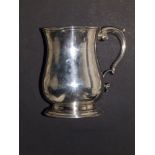 An early George III silver baluster tankard, of plain design with double-curve handle, JP London