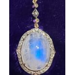 An early 20thC certified natural moonstone (labradorite moonstone) & diamond set pendant , the